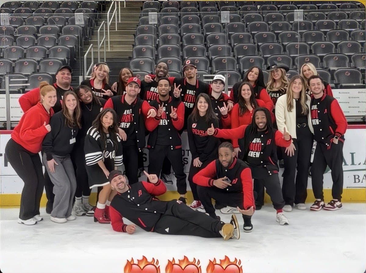 Full crew group photo in an arena stand